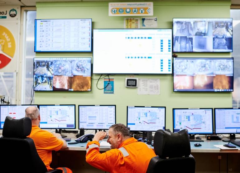 two plant technicians in the control room